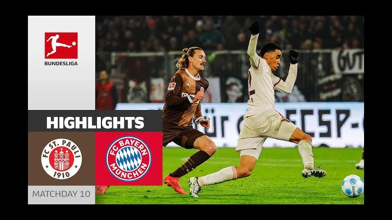 Cầu thủ Bayern Munich với chiếc áo đỏ đang cố gắng vượt qua phòng ngự của St. Pauli trong…
